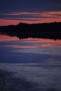 Scenic view of lake against romantic sky at sunset