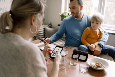 Family using various technologies at home