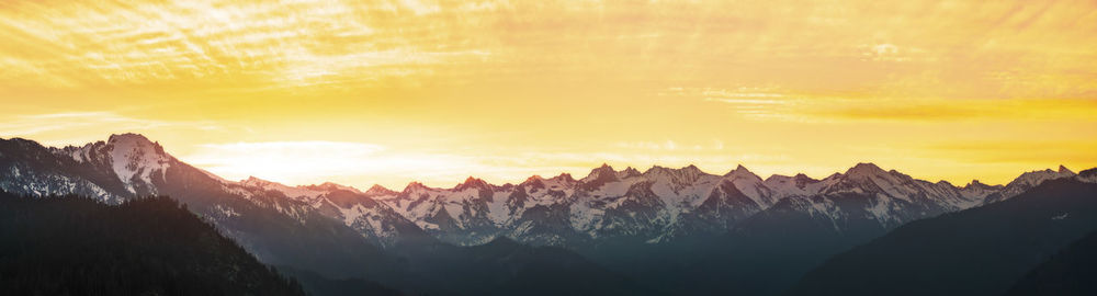 Panoramic view of mountains against sky during sunset