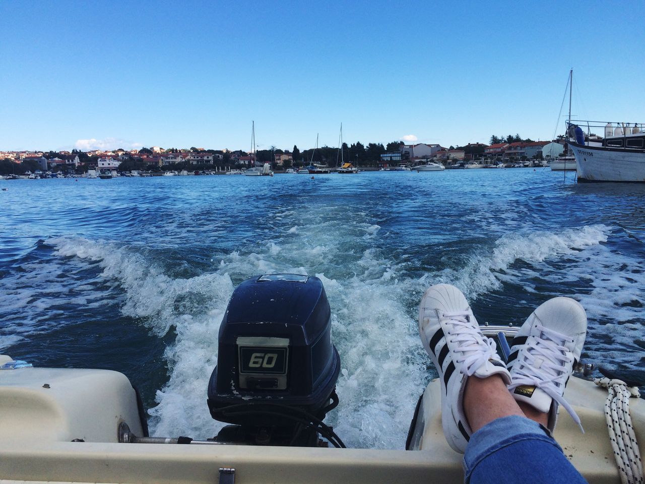 sea, human body part, water, one person, transportation, low section, nautical vessel, real people, day, sky, one woman only, adults only, adult, human leg, human hand, only women, horizon over water, people, outdoors