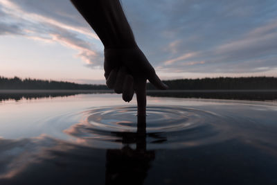 Poke your finger into the water. interaction with the environment