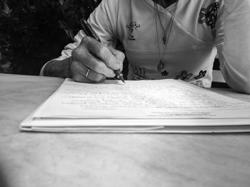 Low section of woman holding hands