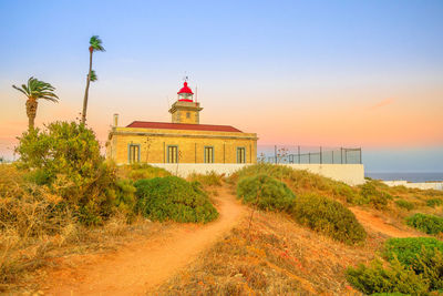 View of building by sea against sky