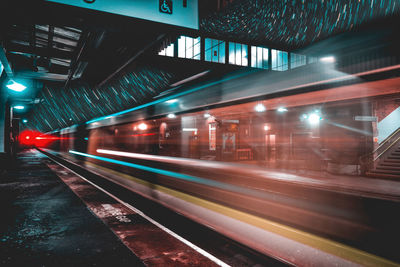 Train at railroad station at night