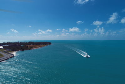 Scenic view of sea against blue sky