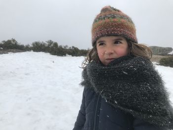 Portrait of smiling woman in snow