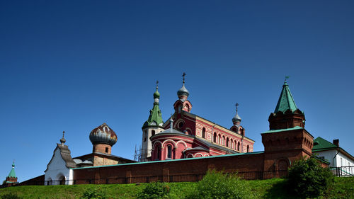 Low angle view of building against clear blue sky