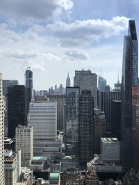 Modern buildings in city against sky