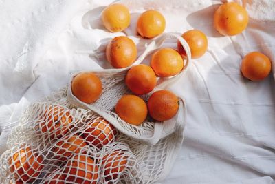 High angle view of orange fruits on table