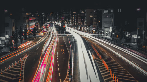 High angle view of light trails on road at night