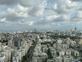 High angle view of modern buildings in city against sky