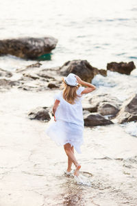 Rear view of woman on beach