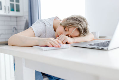 Man using laptop on table