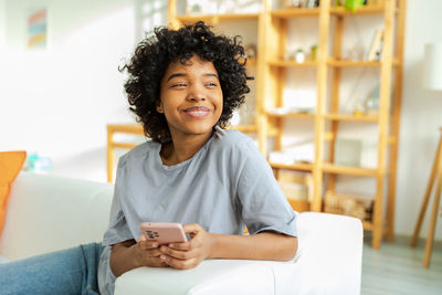 Young woman using mobile phone