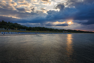 Scenic view of beach against sky during sunset