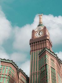 Low angle view of buildings against cloudy sky