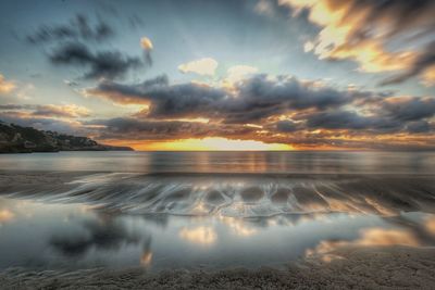 Scenic view of lake against sky during sunset