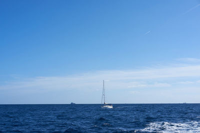 Scenic view of sea against blue sky