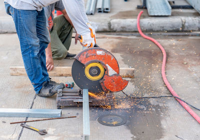 Low section of man working at workshop