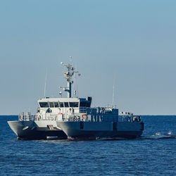 Nautical vessel on sea against clear sky