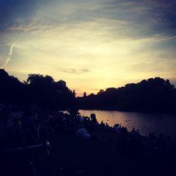 Scenic view of lake at sunset