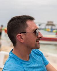 Portrait of young man looking away