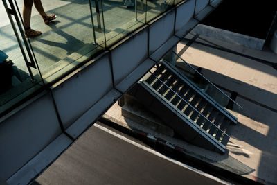 High angle view of people walking on staircase