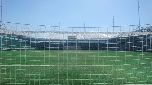 View of soccer field against clear sky