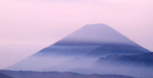 Scenic view of mountains against sky during sunset