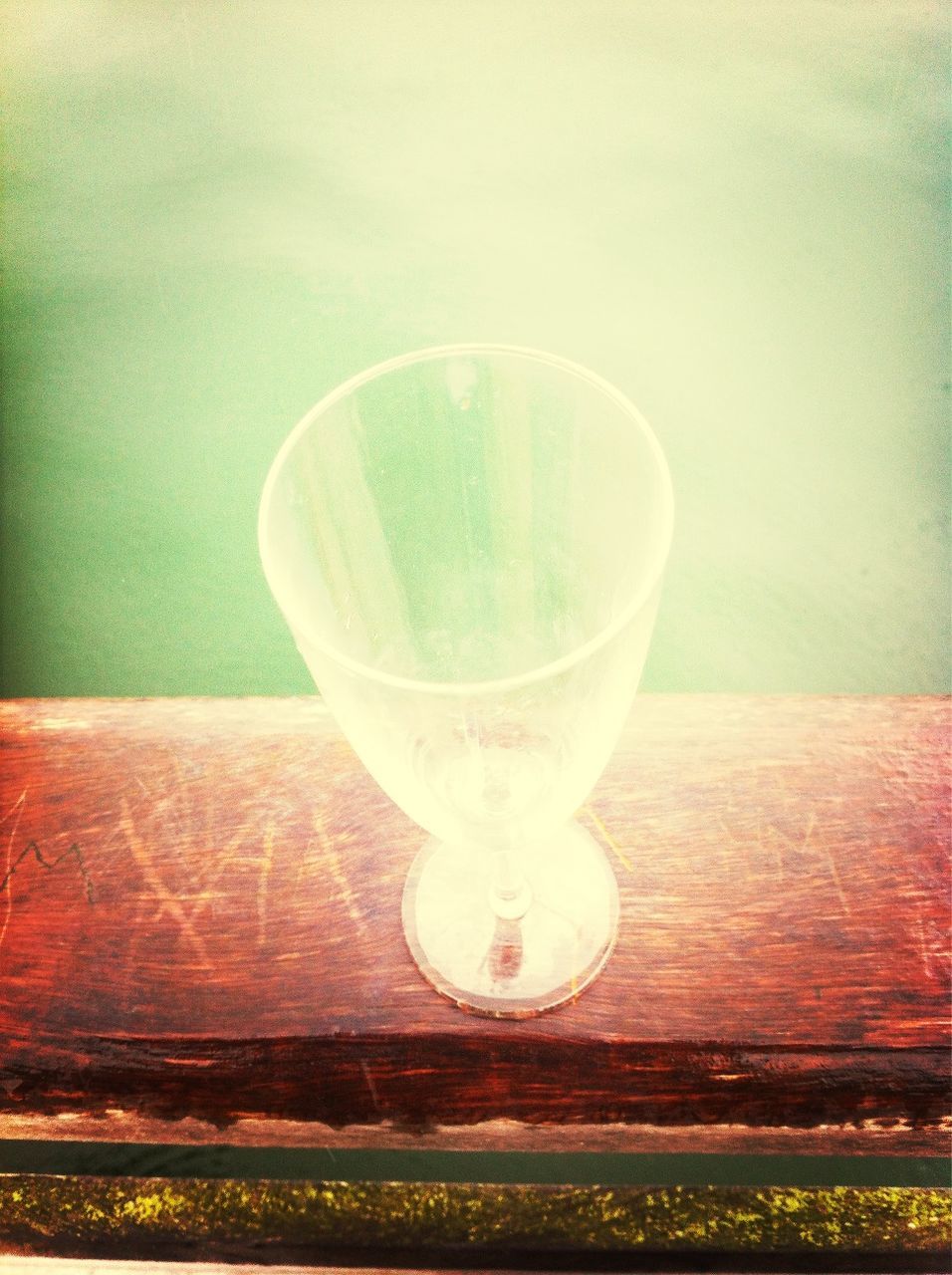 drink, refreshment, table, food and drink, indoors, drinking glass, glass - material, freshness, still life, transparent, close-up, glass, no people, wood - material, focus on foreground, water, alcohol, single object, reflection, day