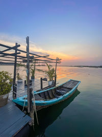 Boats moored at harbor