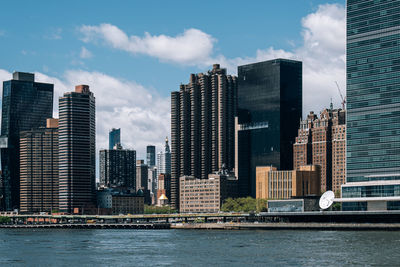 Modern buildings in city against sky