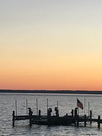 Scenic view of sea against clear sky during sunset