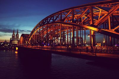 Bridge over river at dusk