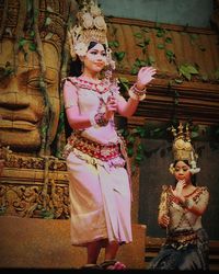 Statue of buddha against temple