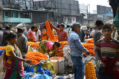 Group of people at market stall