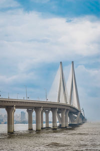 Bridge over sea against sky