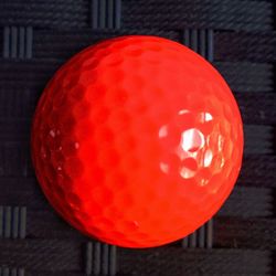 Close-up of red ball on table