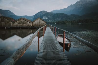 Pier over lake against sky