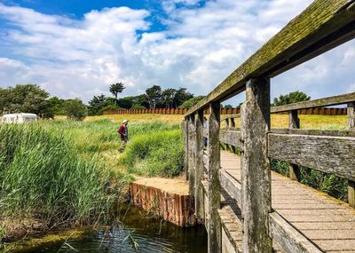 View of bridge over canal against sky