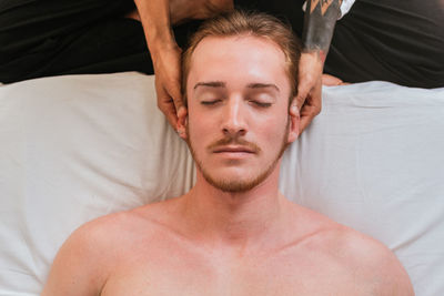 Therapist massaging customer in spa