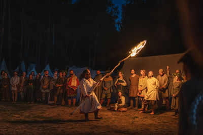 Group of people at music concert at night