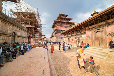 Group of people in front of historical building