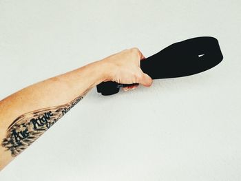 Close-up of woman hand over white background