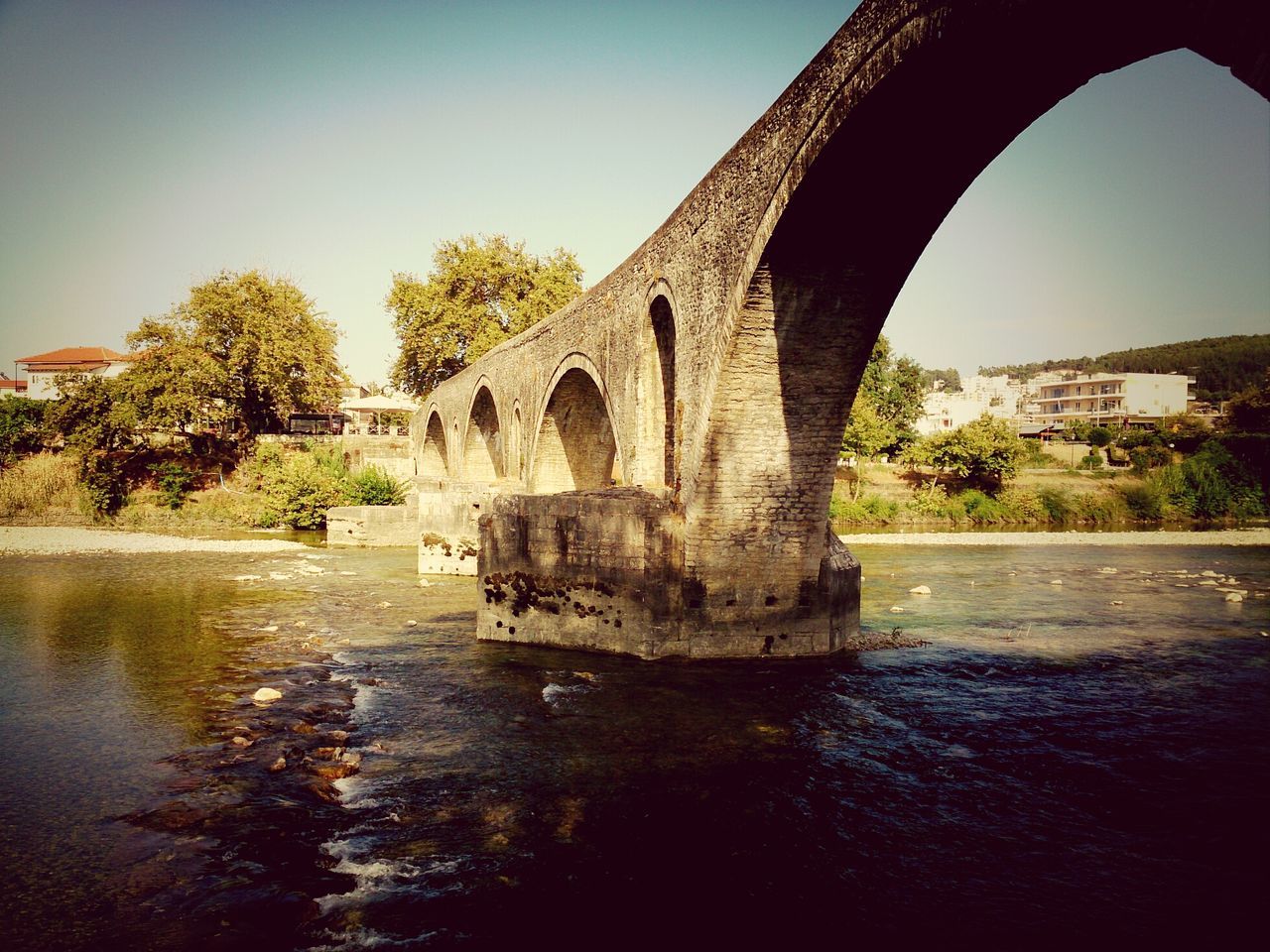 architecture, built structure, water, building exterior, waterfront, clear sky, river, arch, history, reflection, arch bridge, tree, famous place, castle, travel destinations, sky, the past, travel, day, tourism