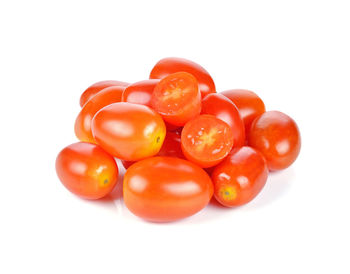 Close-up of tomatoes over white background
