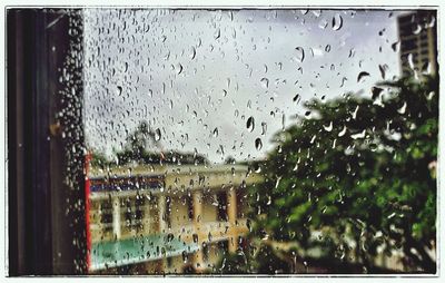 Raindrops on glass window during rainy season