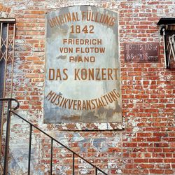 Information sign on brick wall