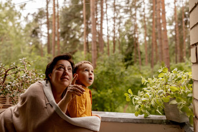 Happy grandmother and grandson enjoy time together. positive middle age woman