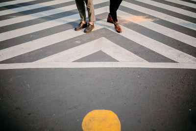 Low section of people crossing road